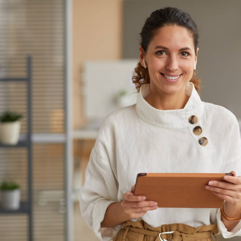 portrait-of-modern-businesswoman-holding-tablet-SWHSPWH.jpg